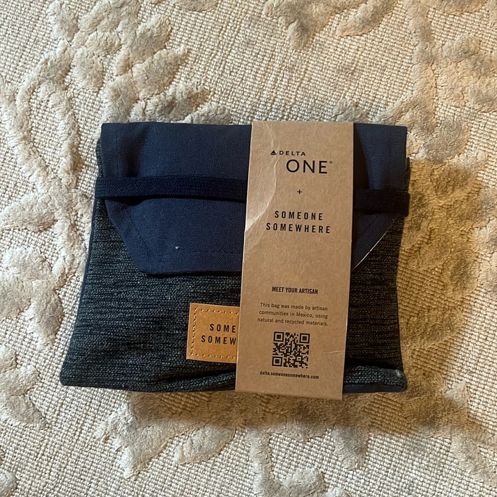 - Delta One Someone Somewhere Amenity Kit. Artisan-Made. Grey/Blue